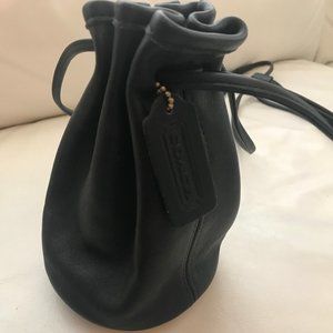 Coach small draw string cross body leather bag